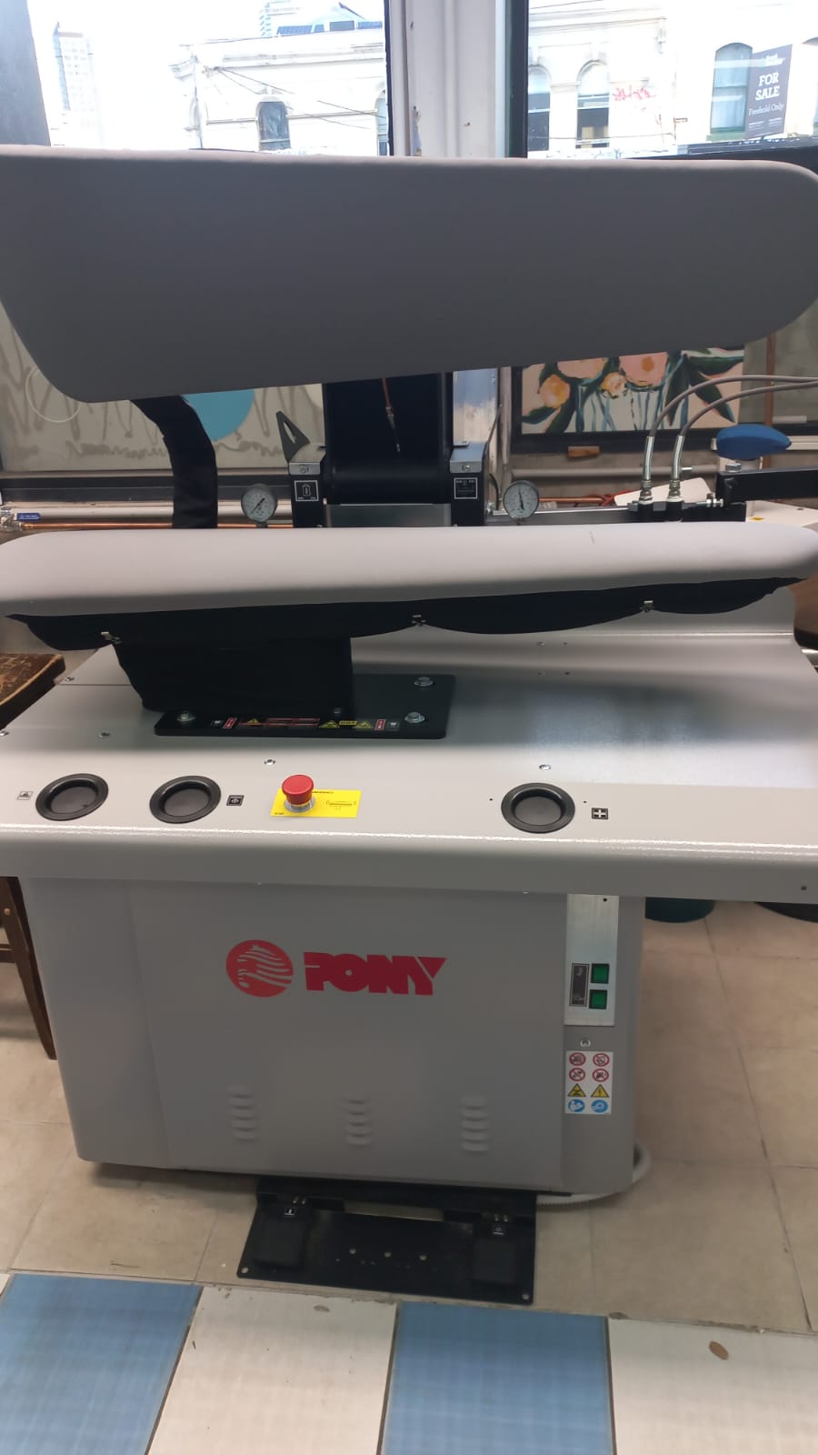Professional garment pressing equipment inside the Sew Stunning workshop
