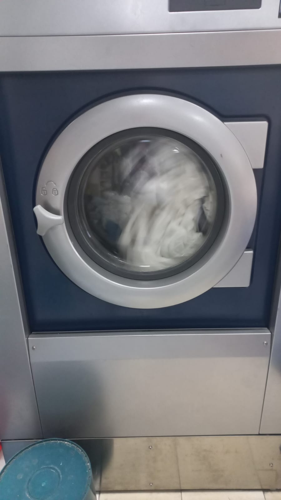Commercial washing equipment processing garments at Sew Stunning